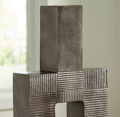 Top view of tall metal vase column with striped block pattern and open square center