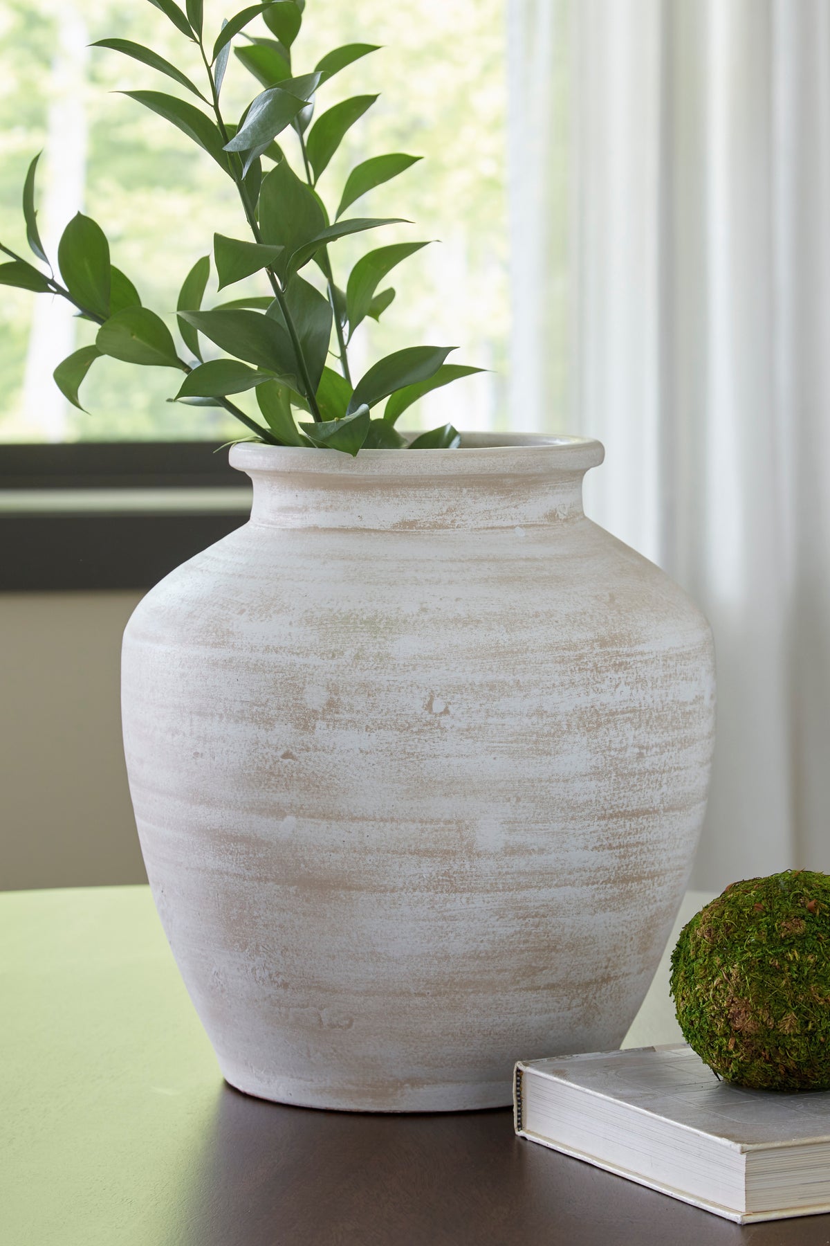 White textured ceramic vase with wide mouth and fluted body, short pedestal base