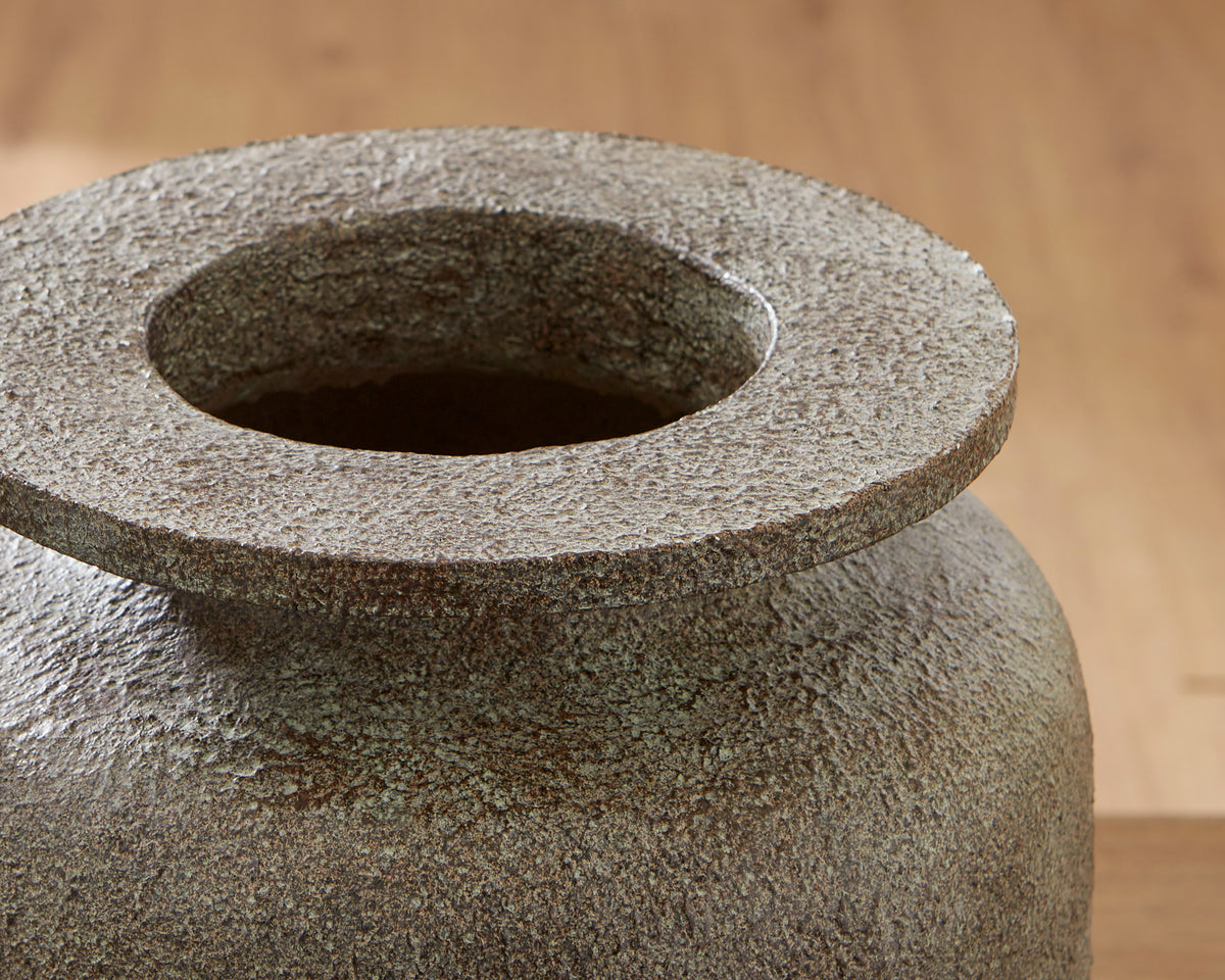 Close-up of vase mouth with flared ring opening and speckled dark gray texture