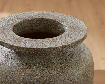 Close-up of vase mouth with flared ring opening and speckled dark gray texture