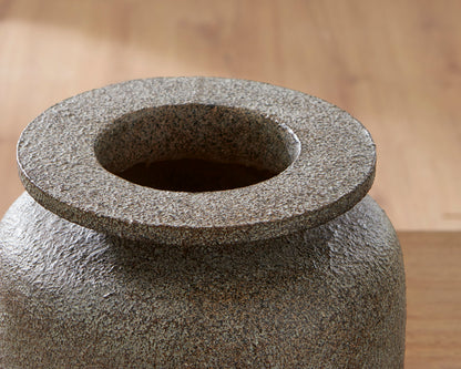 Close-up of textured vase top with wide circular opening, dark gray speckle