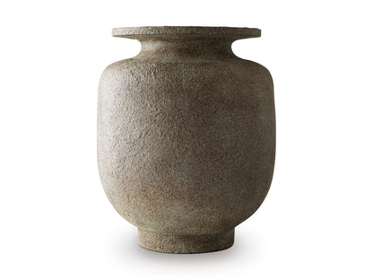 Minimal studio view of textured ceramic vase with flared rim, dark gray-brown