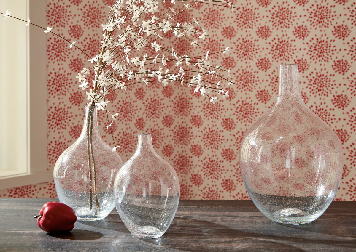Set of three clear glass vases with rounded bodies and narrow necks