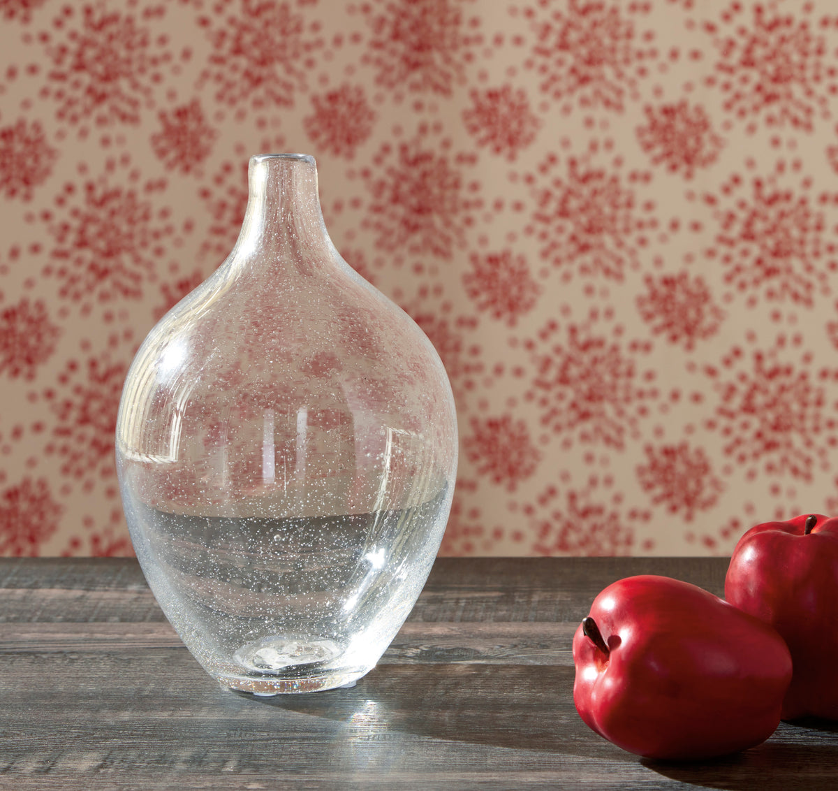 Clear glass vase with rounded body and short cylindrical neck