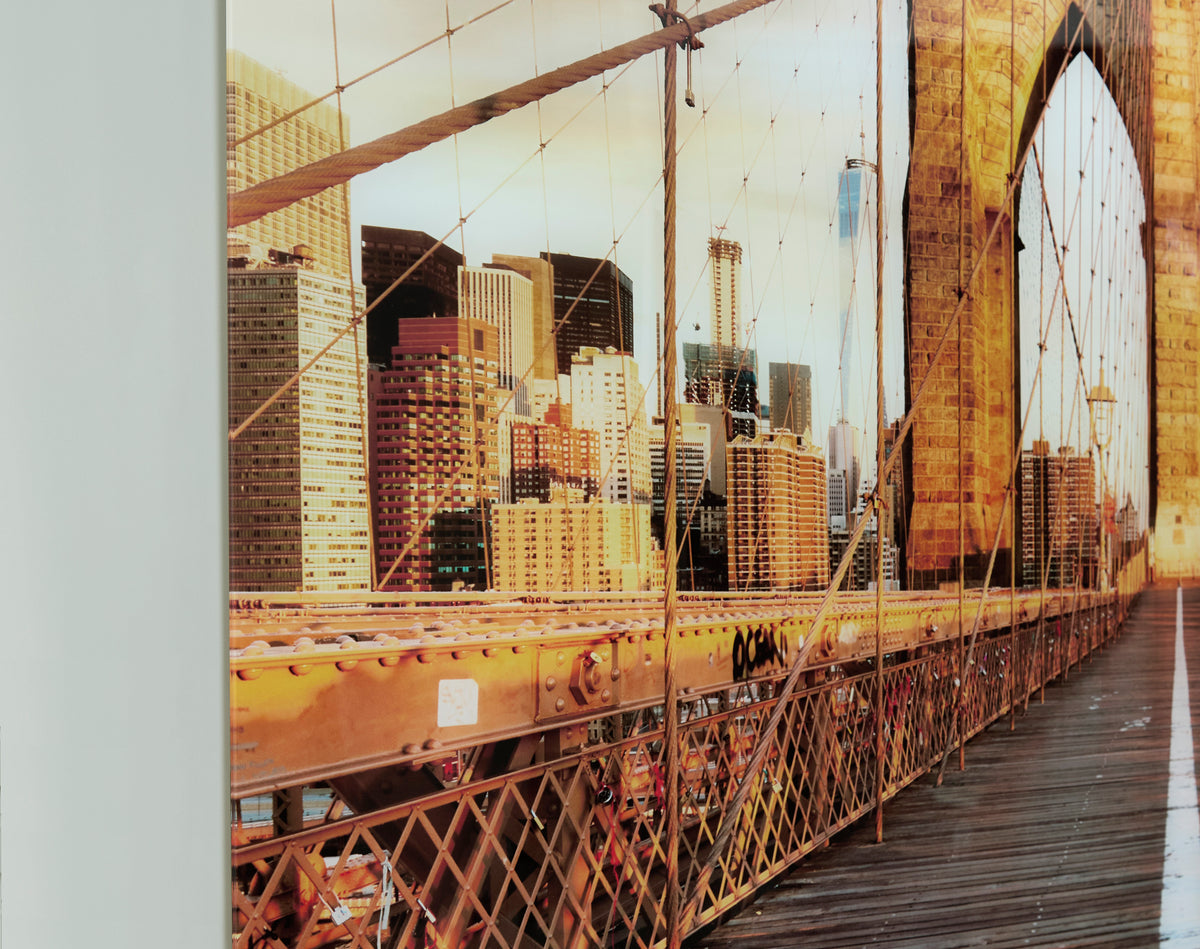 Brooklyn Bridge wall art detail with steel cables and city buildings