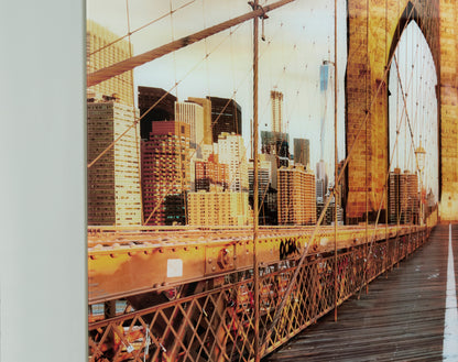 Brooklyn Bridge wall art detail with steel cables and city buildings