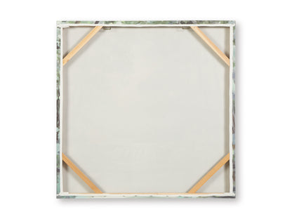 Back of framed wall art with white backing and corner support braces