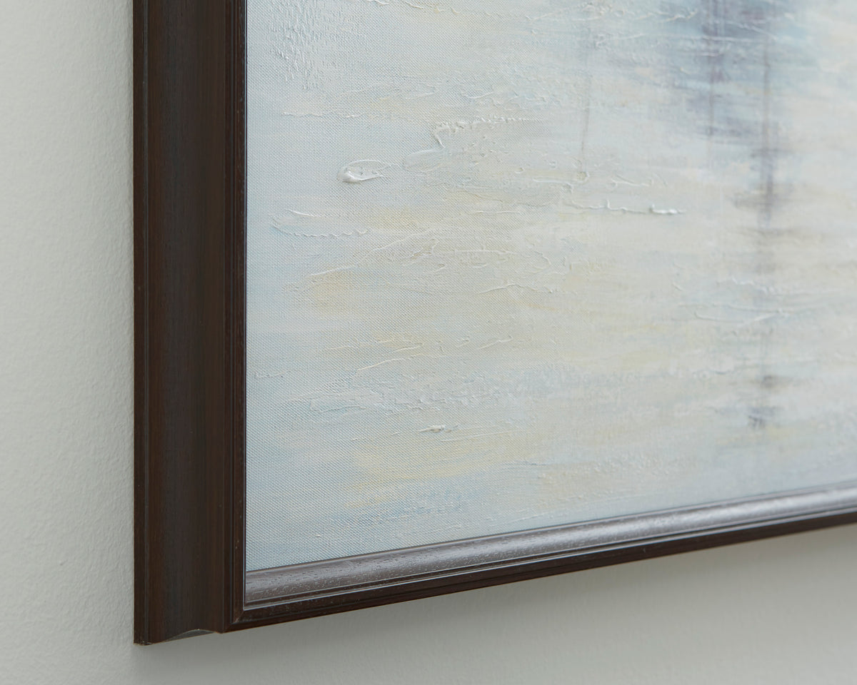 Close-up of dark wood picture frame edge with light blue textured art