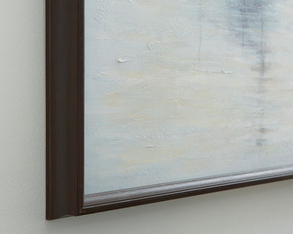 Close-up of dark wood picture frame edge with light blue textured art