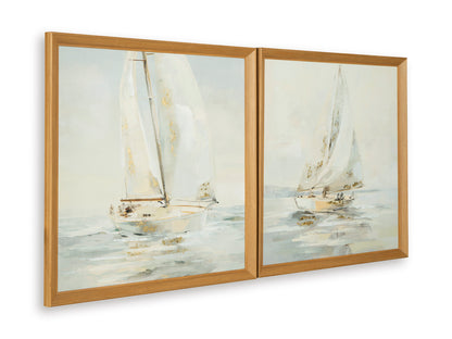 Two sailboat wall art prints in warm wood frames, side-by-side view