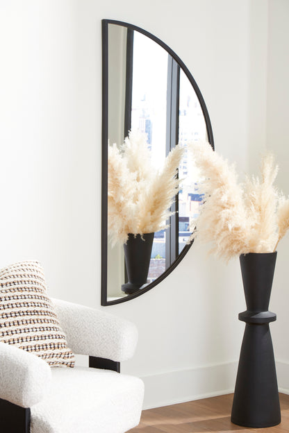 Black-framed arched accent mirror with curved glass and vertical split panel