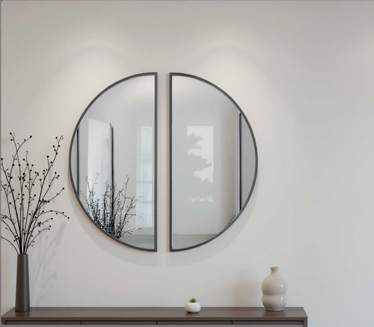 Black-framed round accent mirror with two arched glass panels and central divider