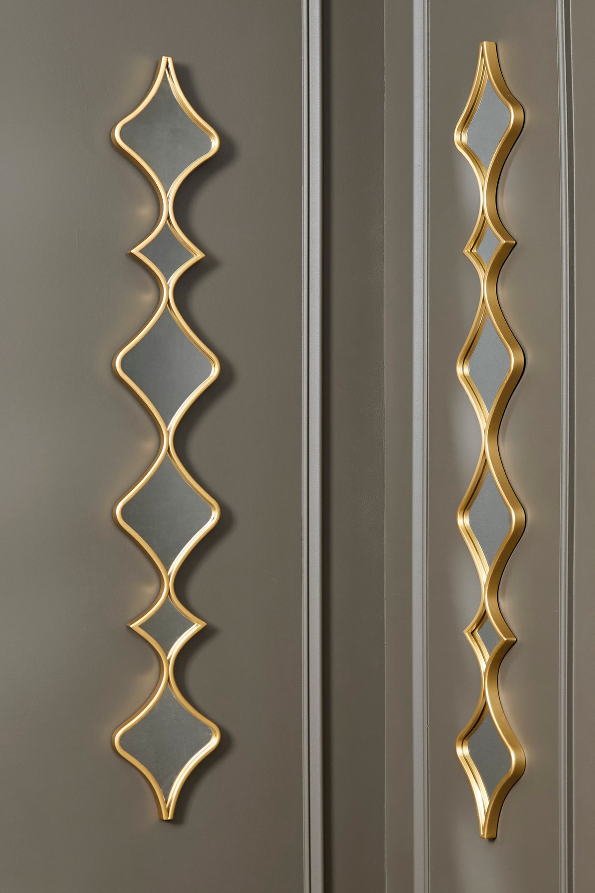 Accent mirror set of 2 with vertical gold geometric frames and dark mirror panels