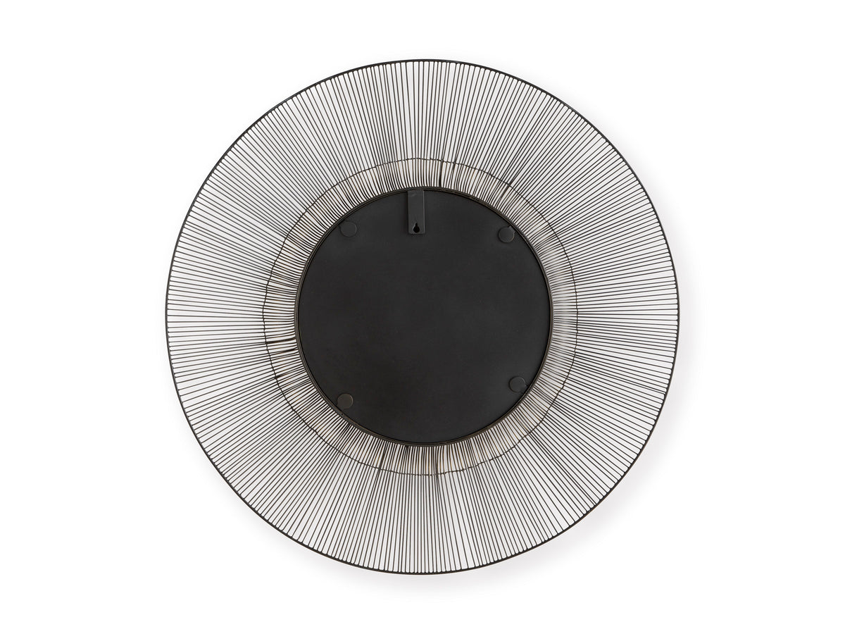 Round accent mirror with black backing and gold-trimmed textured silver frame