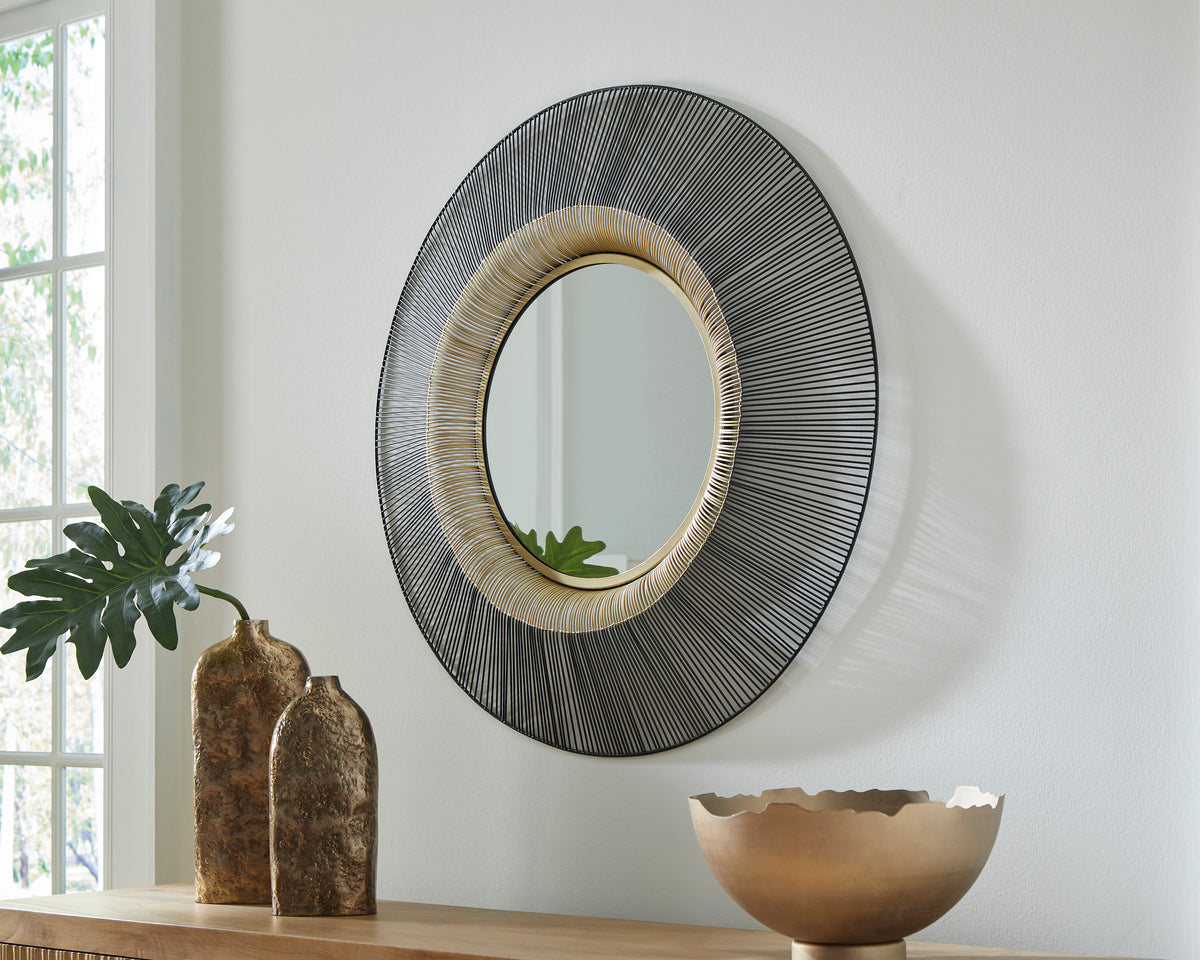 Round accent mirror with black and silver linear metal frame and gold inner ring