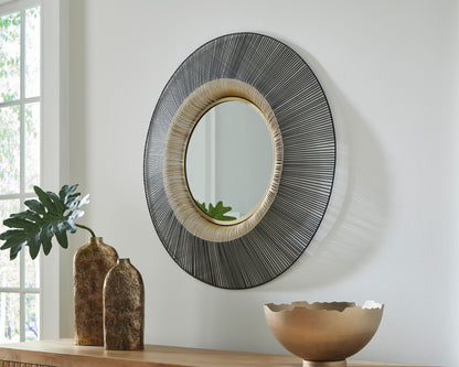 Round accent mirror with black and silver linear metal frame and gold inner ring