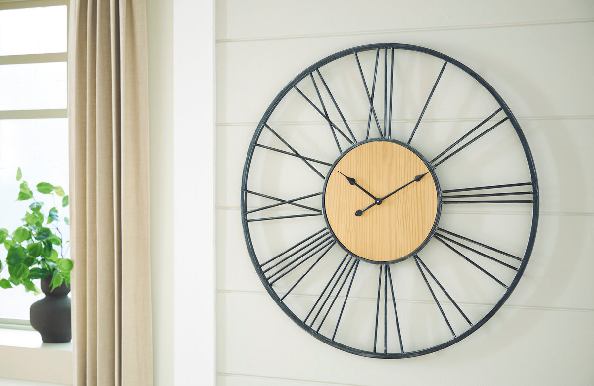 Round wall clock with black metal ring, white radial bars, and wood-tone center