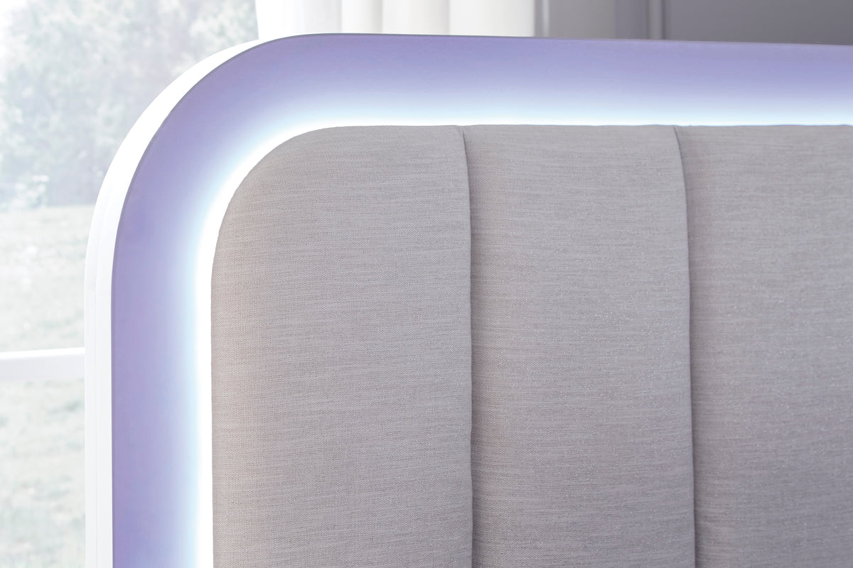 Gray upholstered panel headboard with rounded LED-lit trim