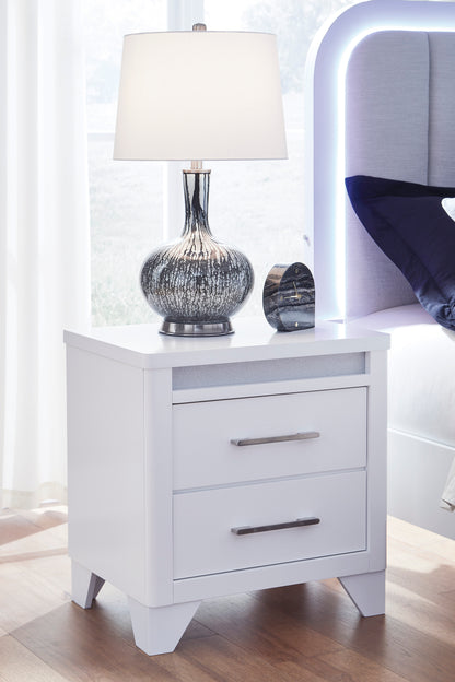 White nightstand with two drawers, silver bar pulls, and tapered legs.