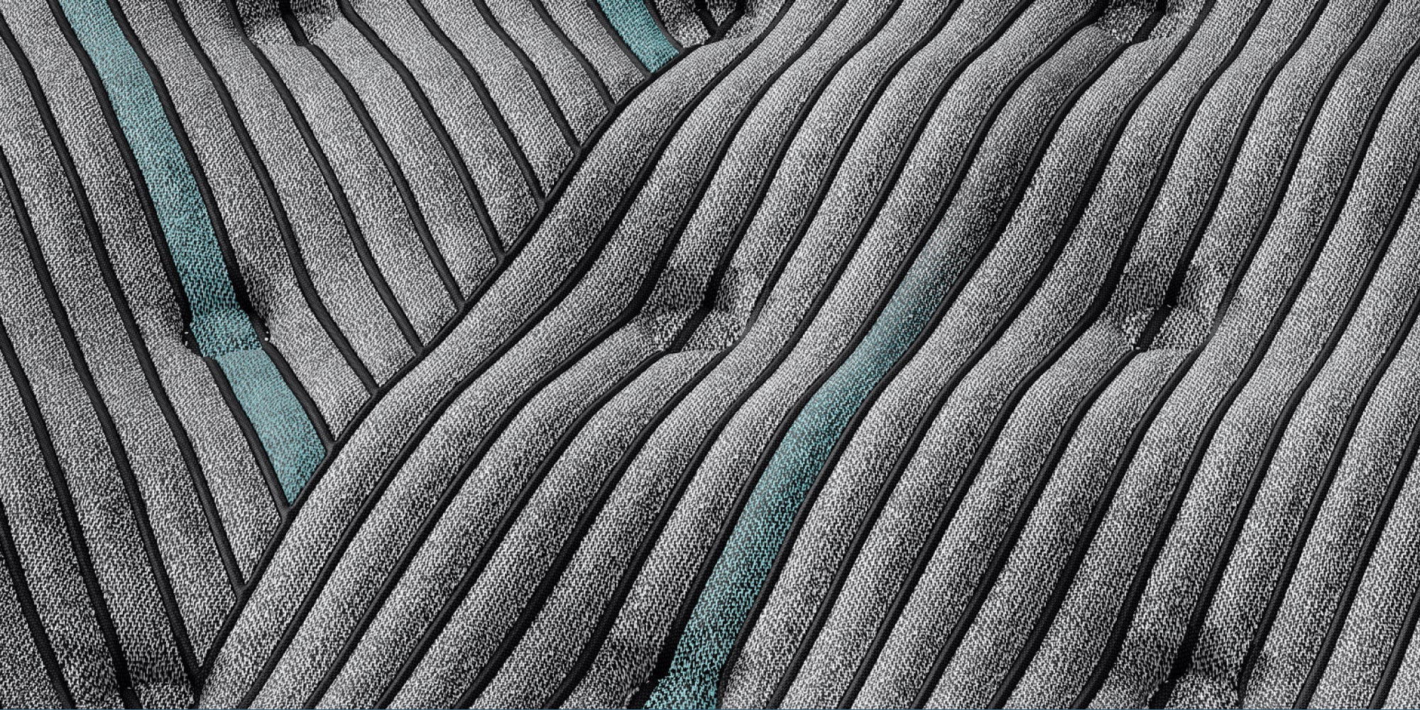 Close-up of textured fabric on mattress with wavy pattern