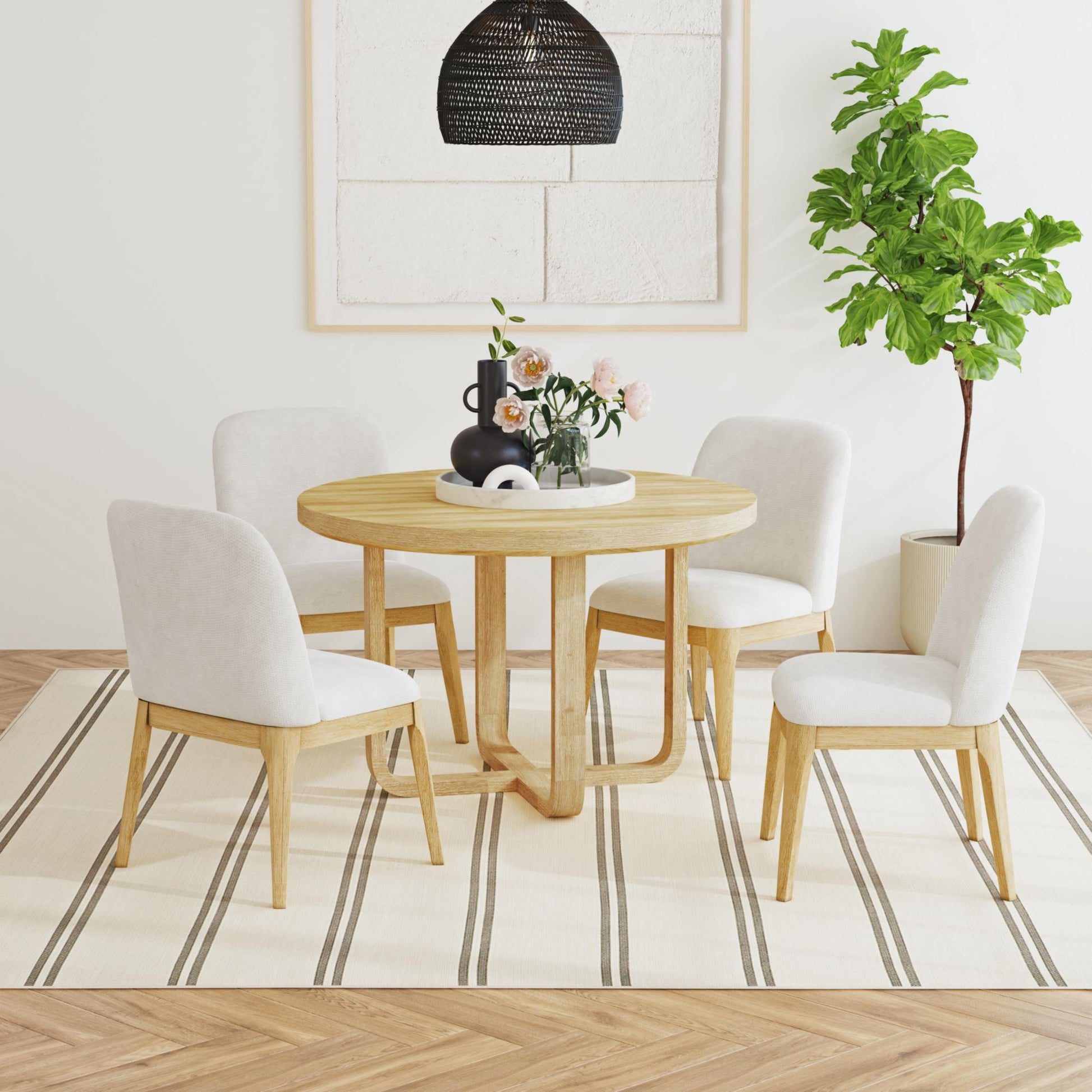 Wood dining table with four upholstered chairs, light gray fabric