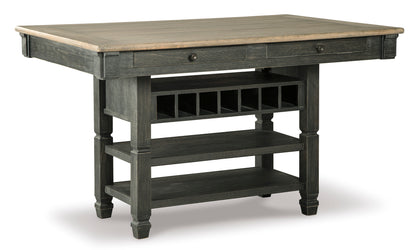 Gray counter-height dining table with square top, drawer, and lower shelf.