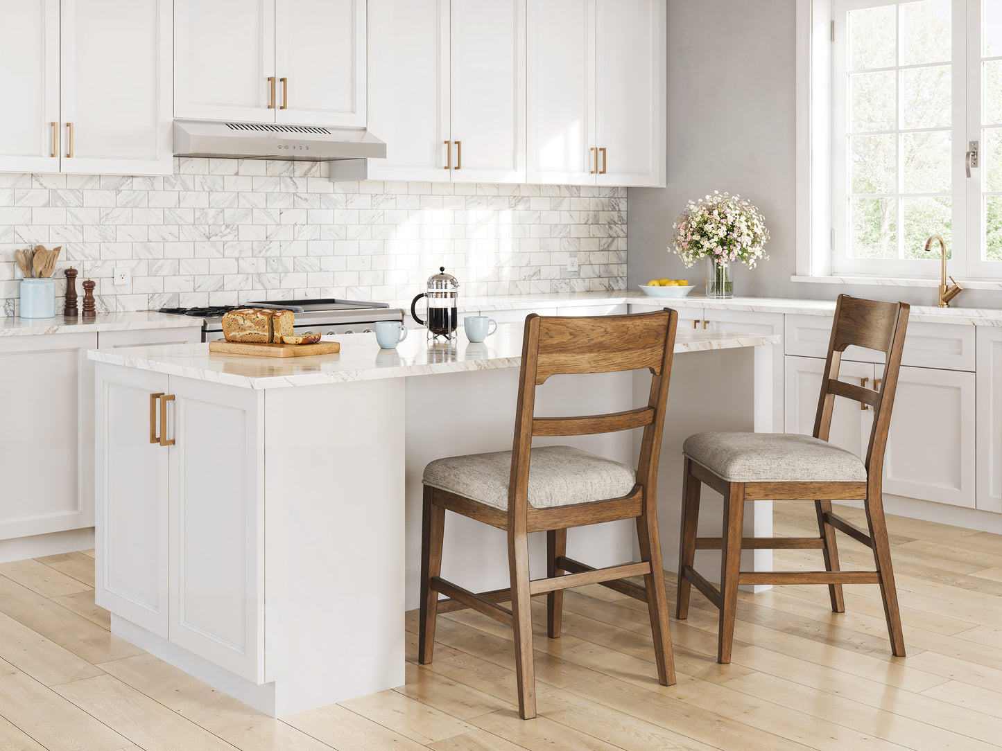 Two walnut counter-height barstools with light gray upholstered seats in a kitchen