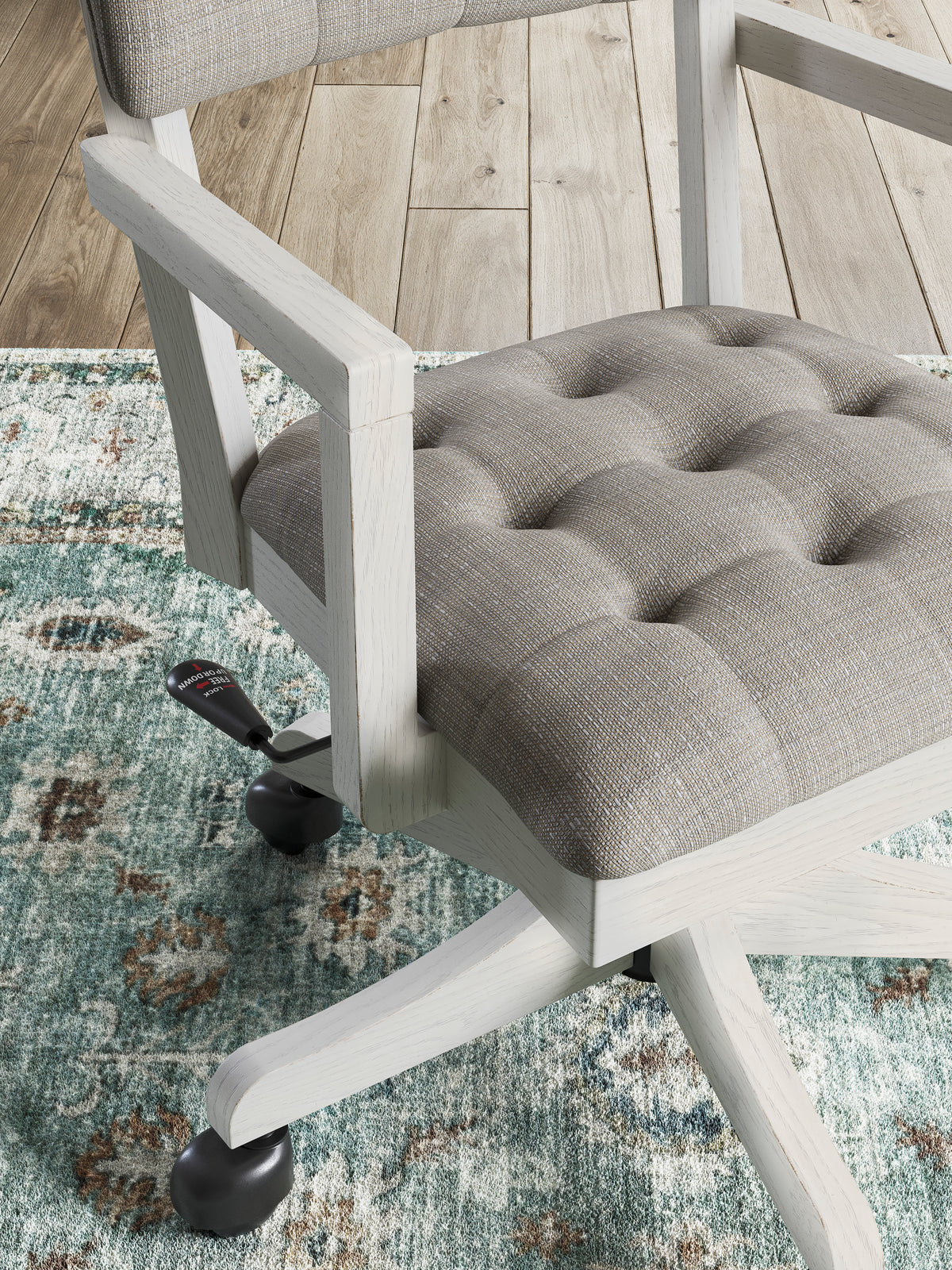 Gray fabric seat cushion on white office chair frame with armrests and caster wheels.