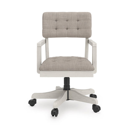 Light-gray upholstered office chair with tufted back, rounded seat, black swivel post, casters.