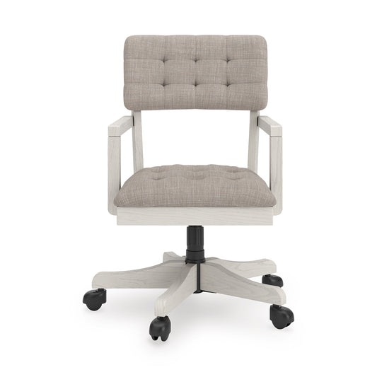 Light-gray upholstered office chair with tufted back, rounded seat, black swivel post, casters.