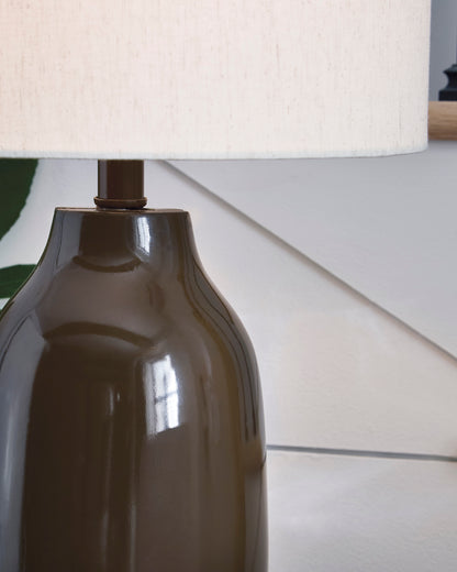 Table lamp close-up with off-white shade and dark brown ceramic base