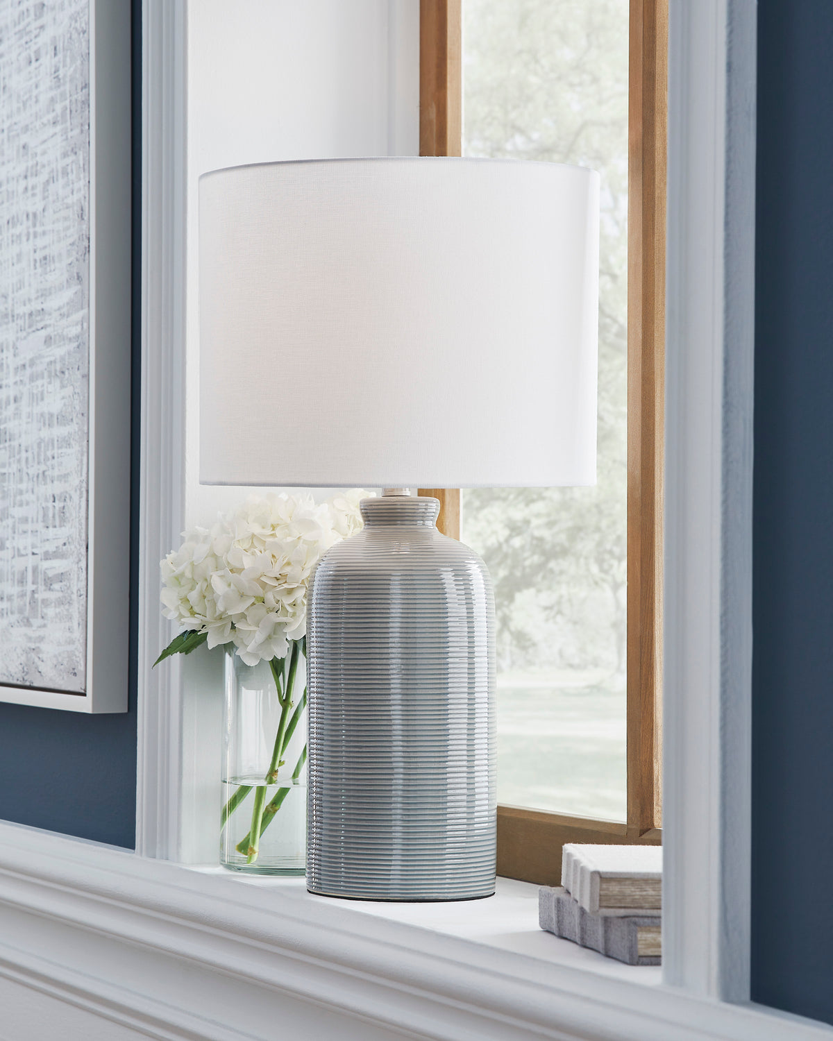 Ceramic table lamp with ribbed blue-and-white base and white drum shade