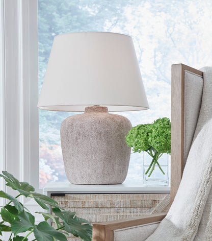 Ashley Danry metal table lamp with white fabric shade and textured beige base
