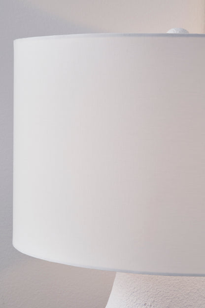 White drum lamp shade with metal base top, close-up