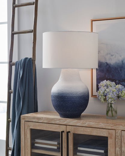 Blue and white speckled metal table lamp with white fabric drum shade