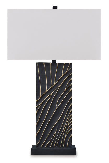 Table lamp with white rectangular shade and black base with gold leaf pattern