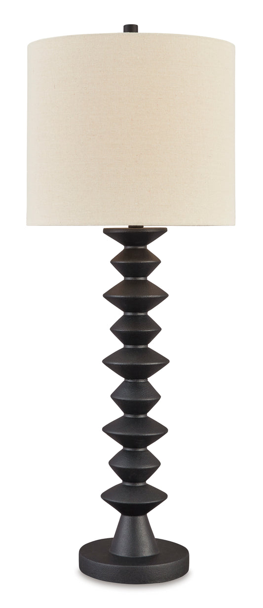 Buffet lamp with cream fabric drum shade and dark stacked-disc base on round foot