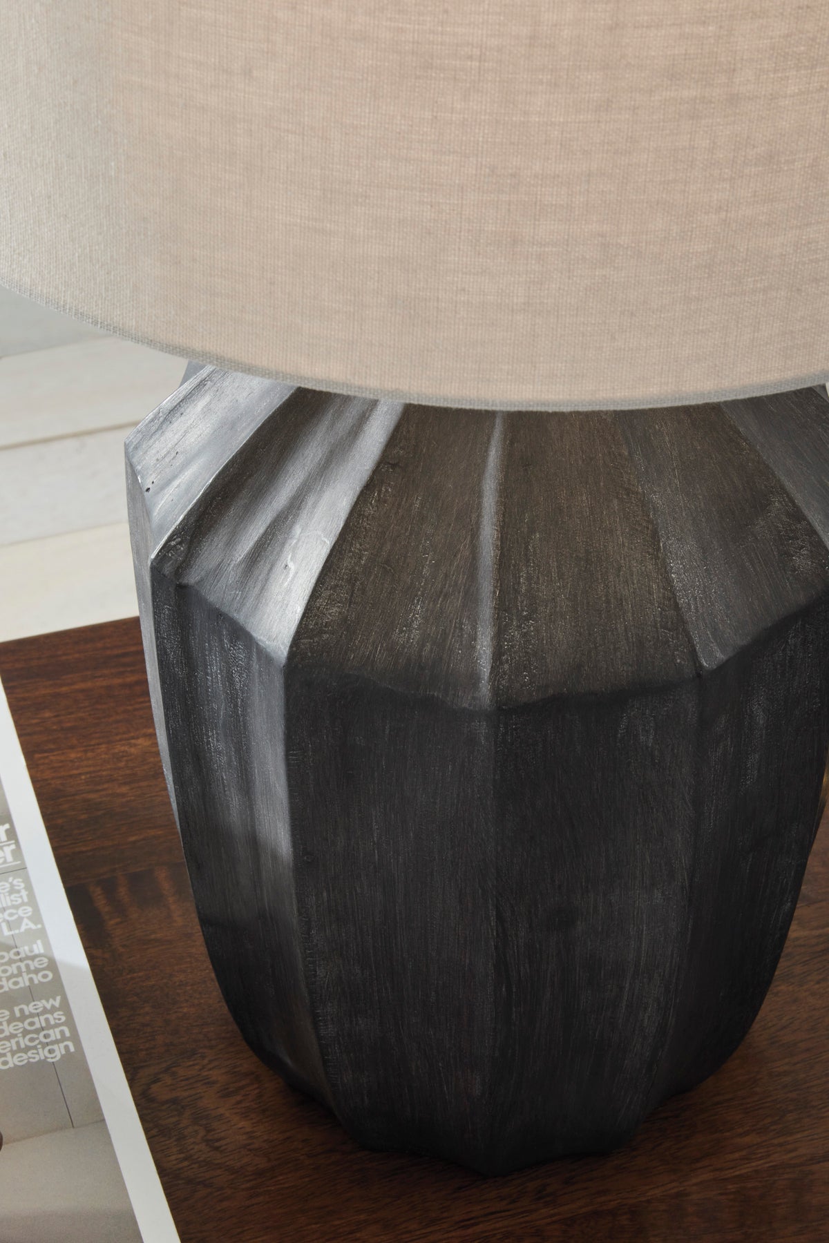 Poly table lamp base close-up in dark gray with faceted textured finish