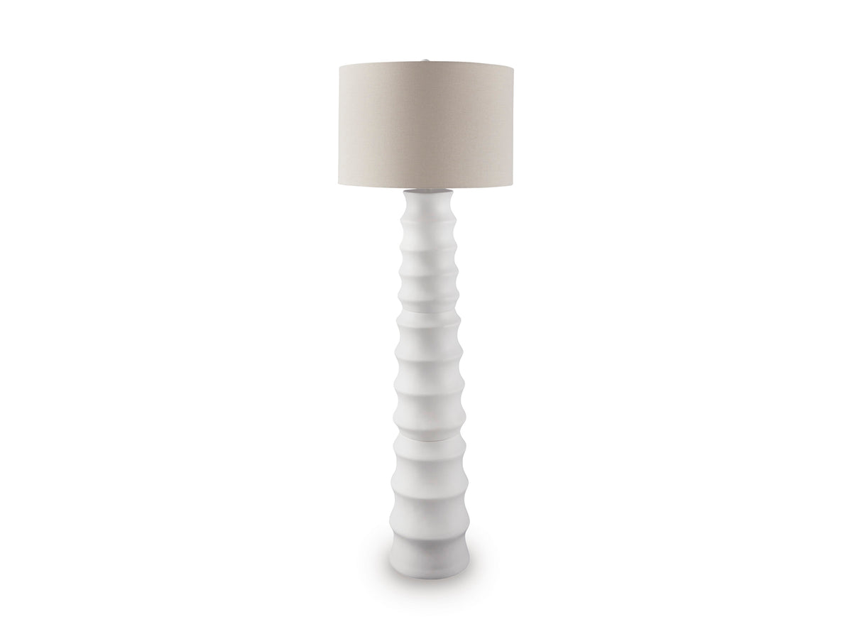 White floor lamp with ribbed base and round tapered fabric drum shade