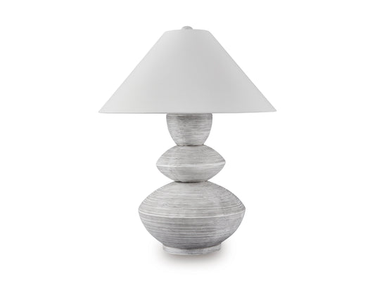 Table lamp with white shade and gray sculpted stacked base