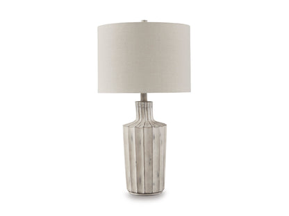 Table lamp with beige drum shade and gray fluted ceramic column base