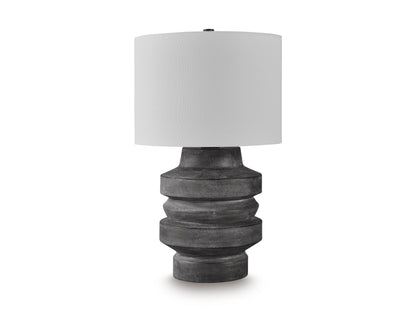 Table lamp with white drum shade and dark gray ribbed sculpted base