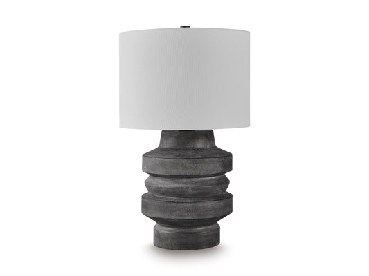 Table lamp with white drum shade and dark gray ribbed sculpted base