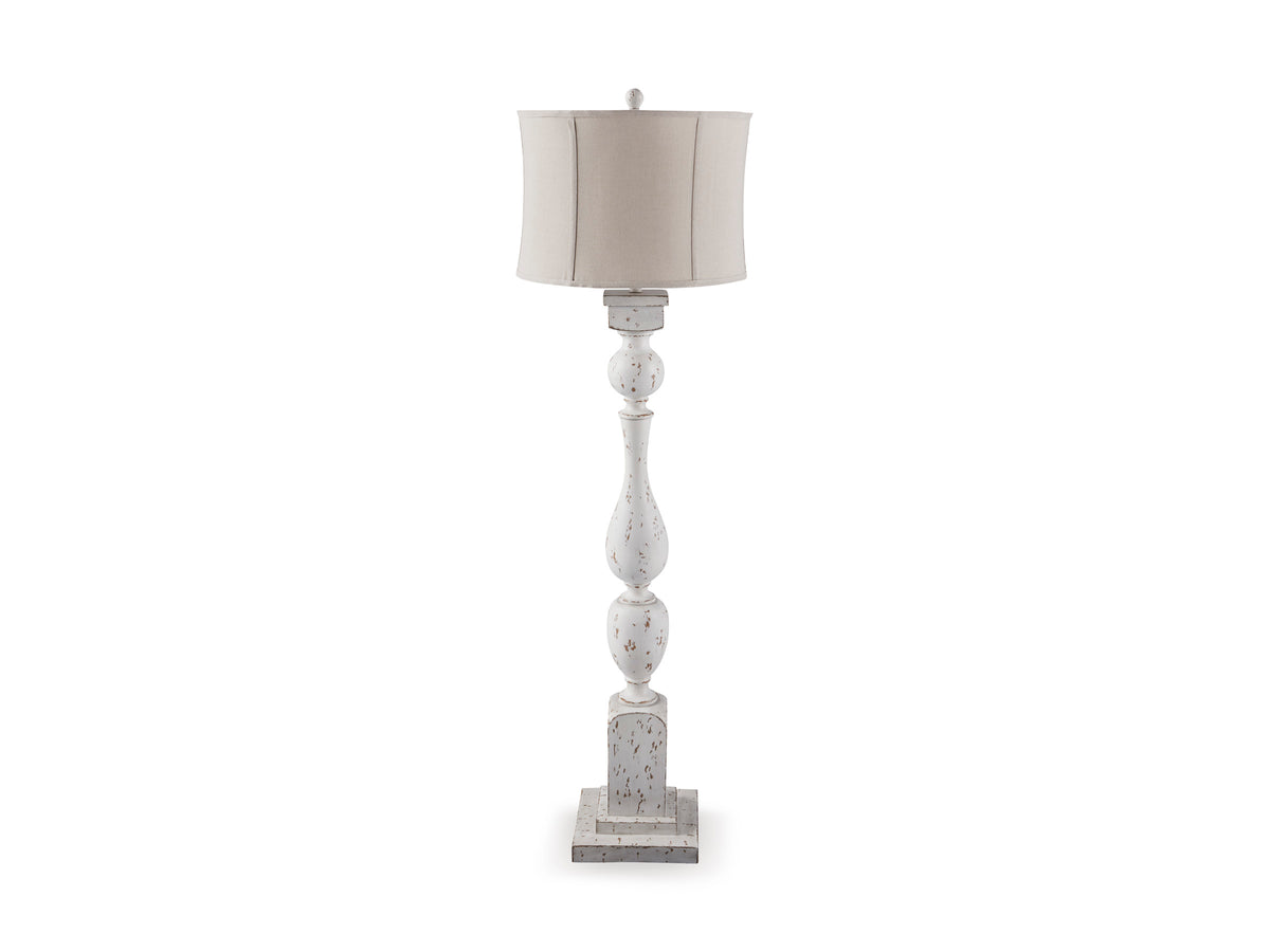 White floor lamp with beige drum shade and stacked turned pedestal base