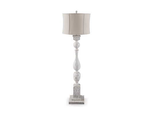 White floor lamp with beige drum shade and stacked turned pedestal base