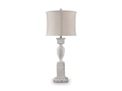White ceramic pedestal table lamp with beige drum shade