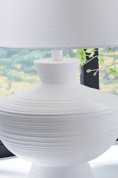 White pleated poly lamp base with stacked texture under white drum shade