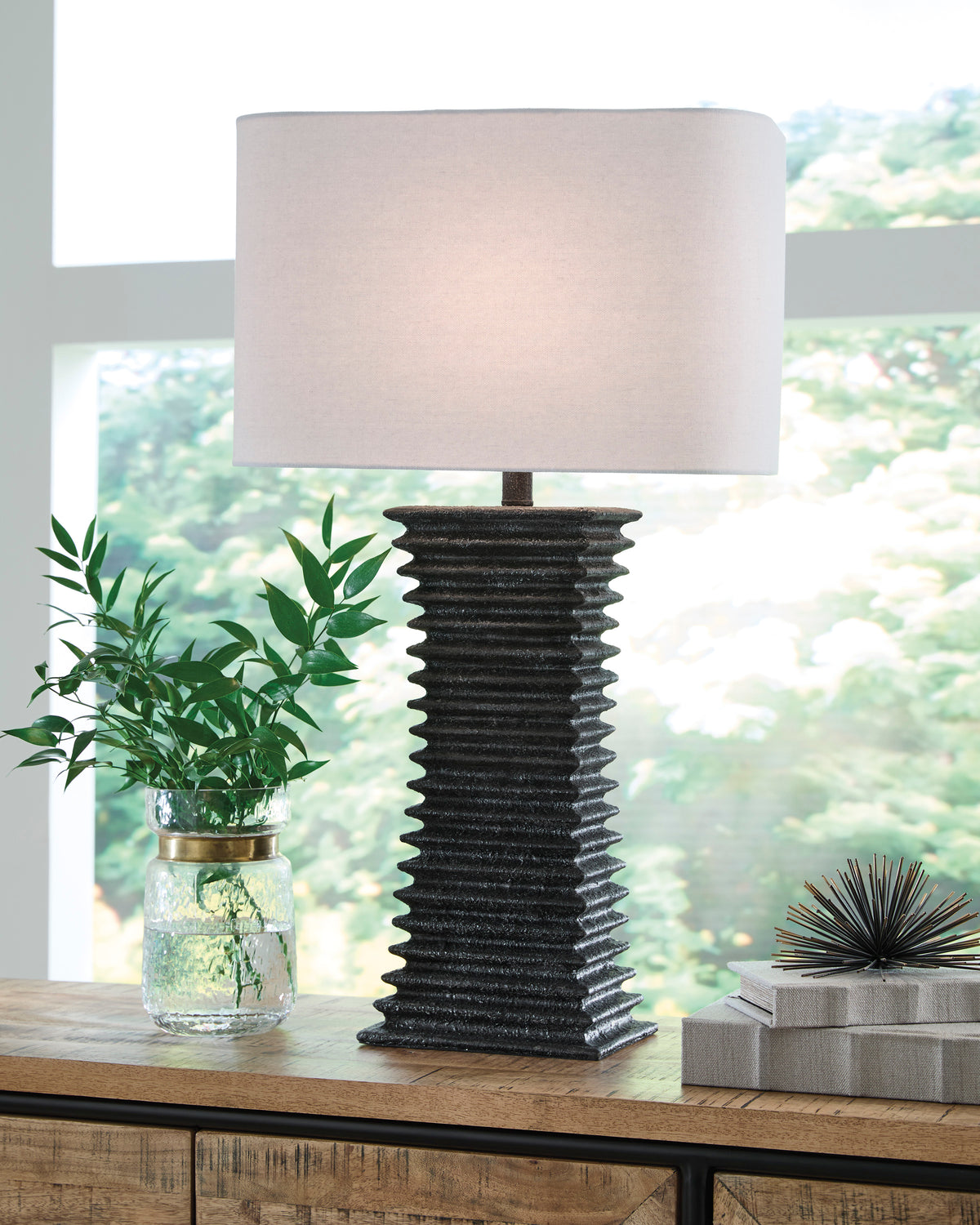 Ribbed black poly table lamp with white fabric drum shade