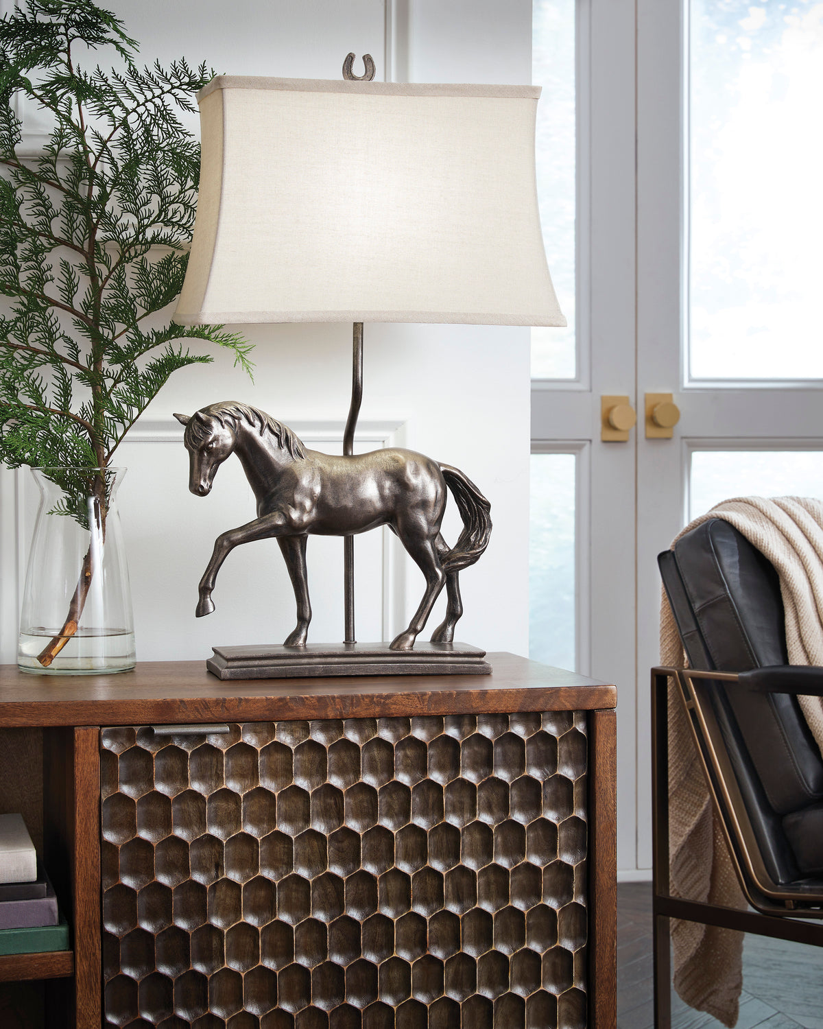 Table lamp with bronze horse figurine base and beige fabric shade