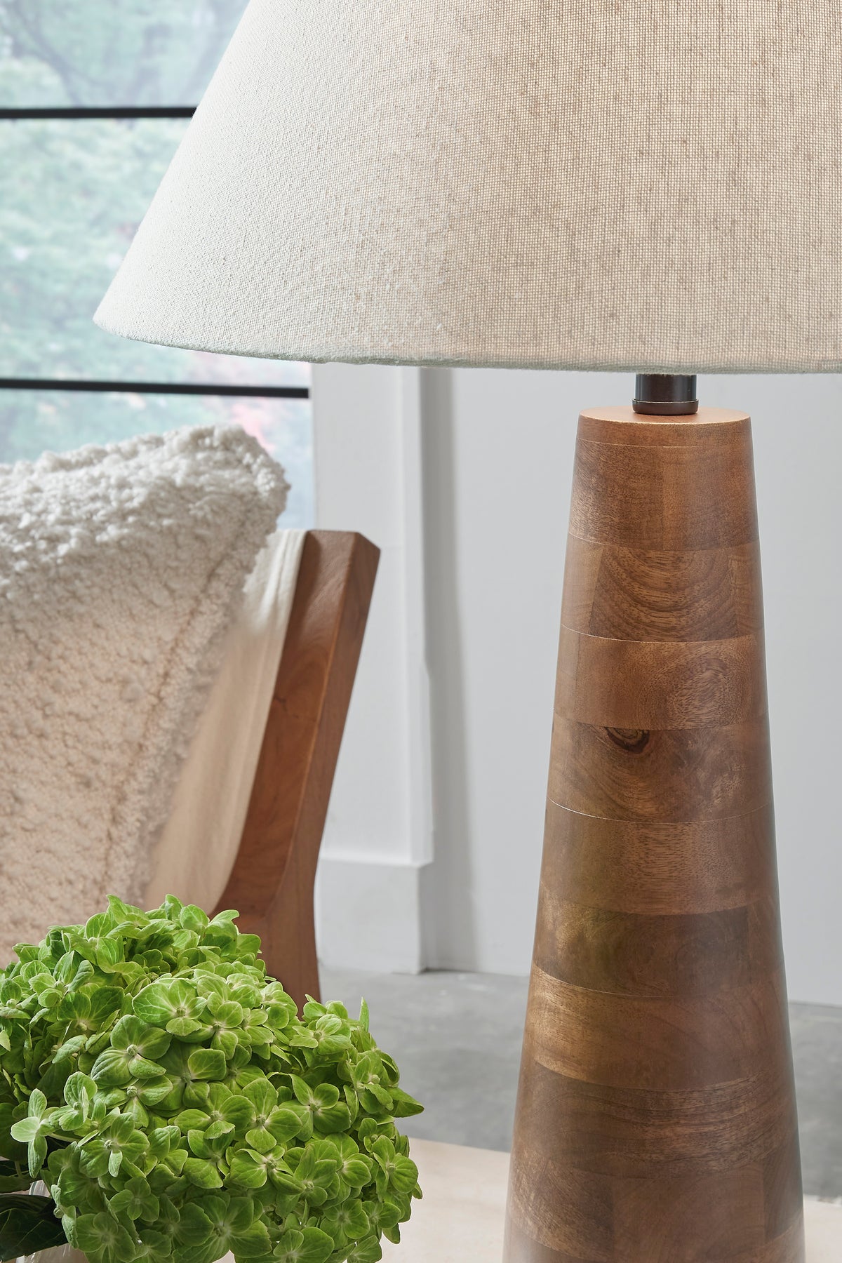 Danset table lamp with beige fabric shade and carved wood base top